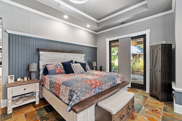 bedroom featuring crown molding, access to exterior, and a tray ceiling