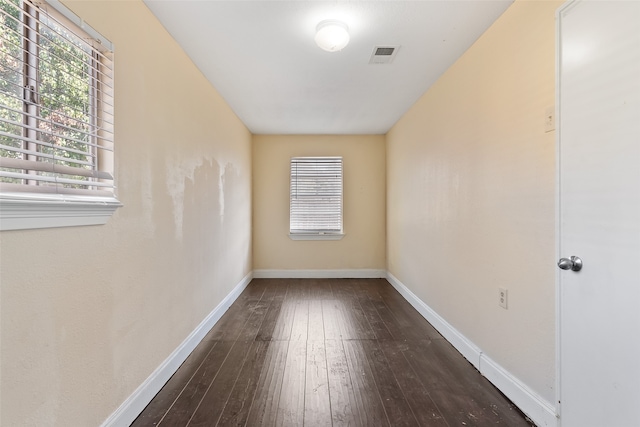 spare room with wood-type flooring