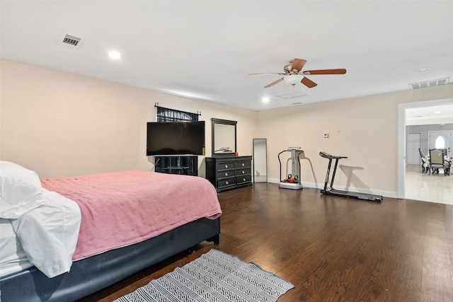 bedroom with dark wood-type flooring and ceiling fan