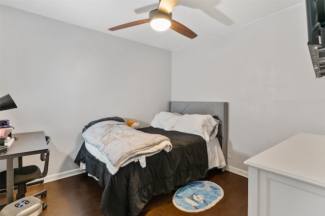 bedroom with dark wood-type flooring and ceiling fan