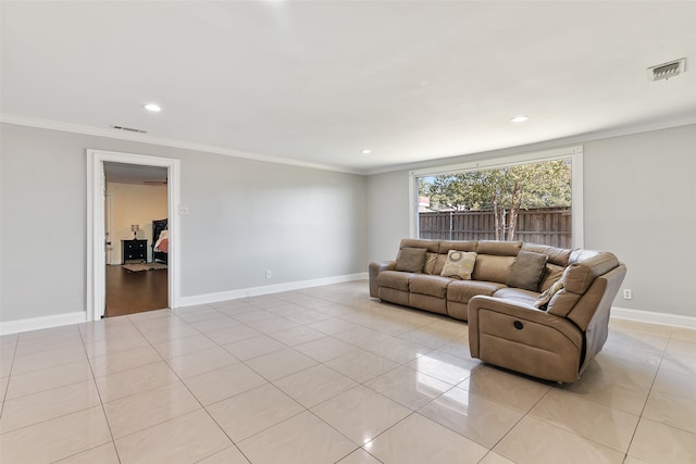 tiled living room featuring ornamental molding