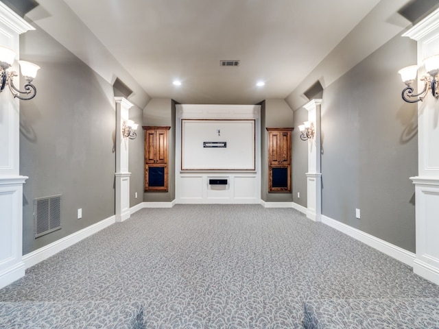 home theater featuring light carpet and decorative columns