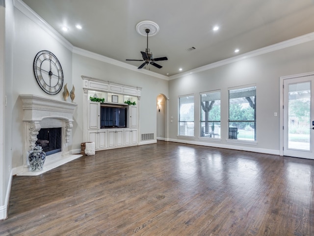 unfurnished living room with ornamental molding, dark wood-type flooring, and ceiling fan