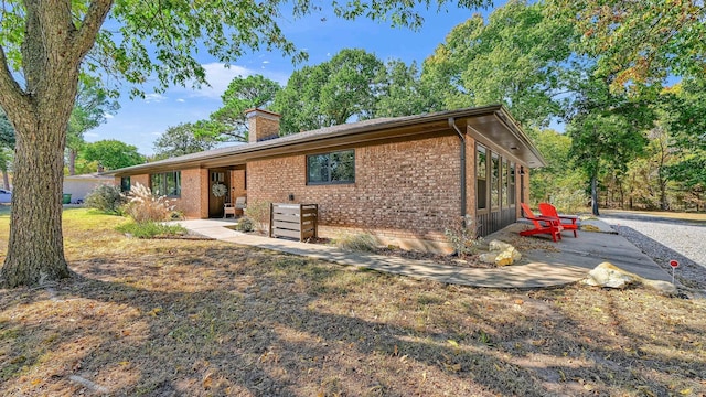 back of property featuring a patio area