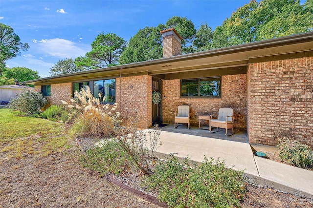 rear view of house with a patio