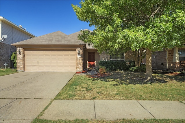 view of front of house featuring a front yard and a garage