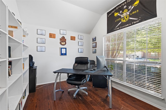 home office featuring dark wood-type flooring and vaulted ceiling