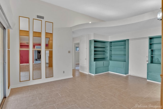 unfurnished room with light tile patterned floors