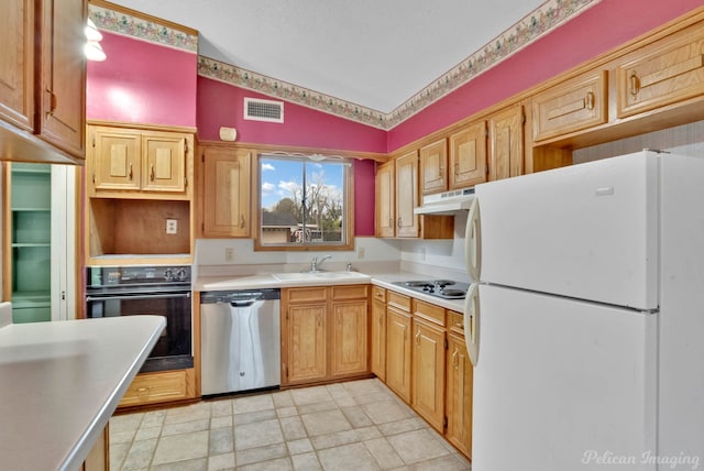 kitchen featuring lofted ceiling, sink, and white appliances