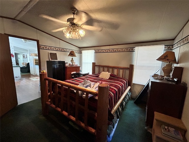 bedroom with ceiling fan, a textured ceiling, lofted ceiling, and dark colored carpet