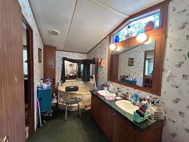 bathroom with vanity, lofted ceiling, and a textured ceiling