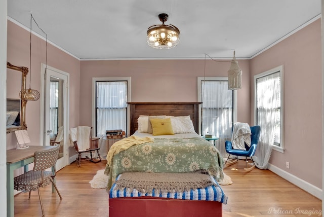 bedroom featuring ornamental molding and hardwood / wood-style flooring