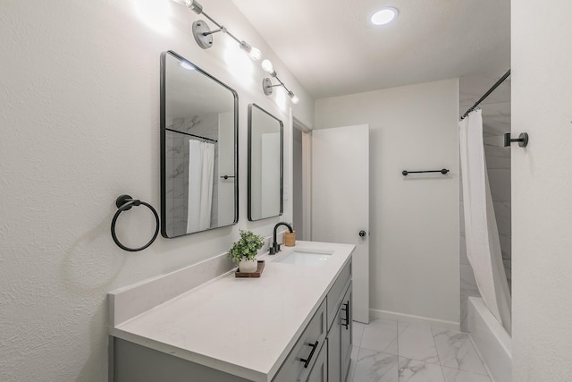 bathroom with vanity and shower / tub combo