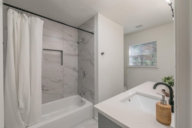 bathroom with shower / tub combo with curtain and vanity