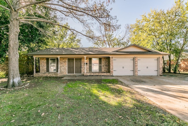 ranch-style home featuring a garage and a front lawn