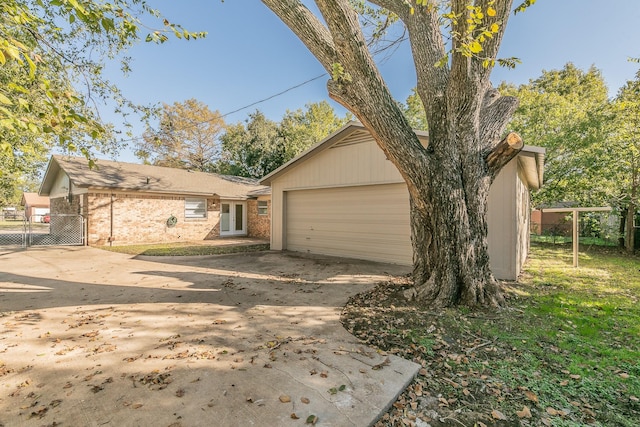 exterior space with a garage and an outdoor structure