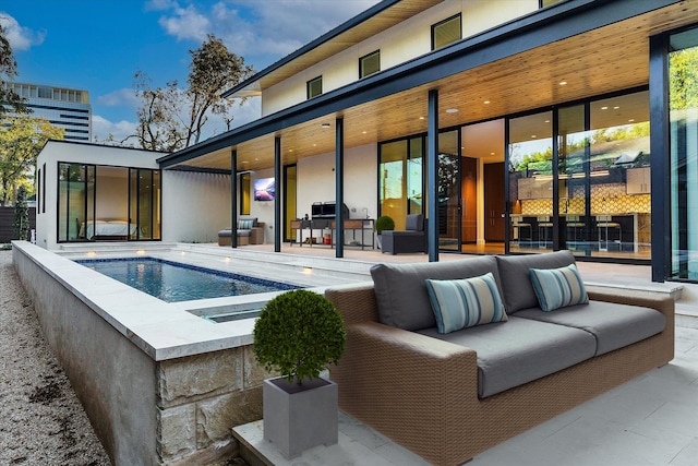 view of pool with a patio and an outdoor hangout area