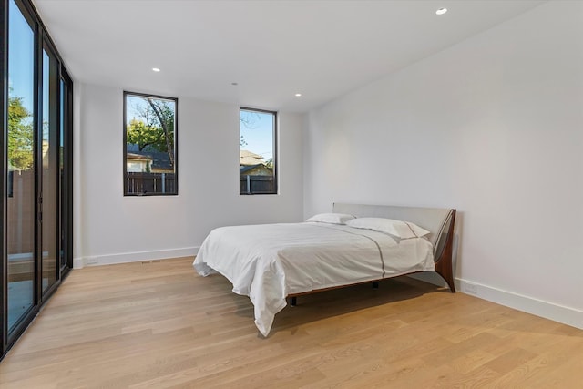 bedroom with light hardwood / wood-style flooring