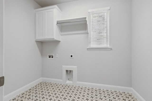 washroom featuring electric dryer hookup, washer hookup, and cabinets