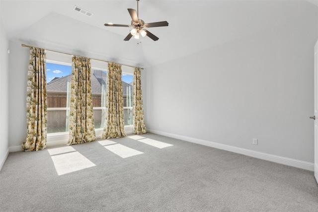 spare room with baseboards, carpet flooring, ceiling fan, and visible vents