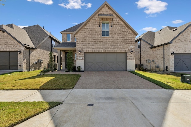 traditional-style home with concrete driveway, brick siding, central AC, and a front yard