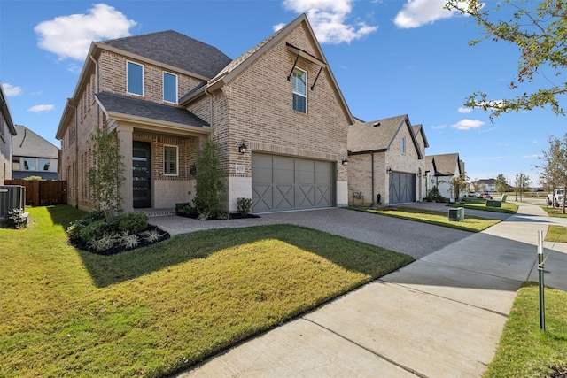 view of front of home featuring a front yard, central AC unit, and a garage