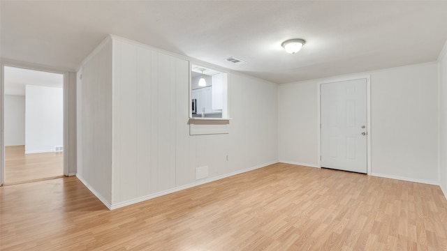 unfurnished room featuring light wood-type flooring