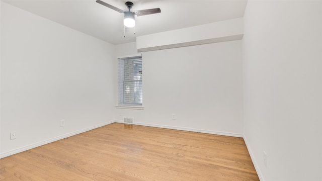 empty room with light hardwood / wood-style flooring and ceiling fan