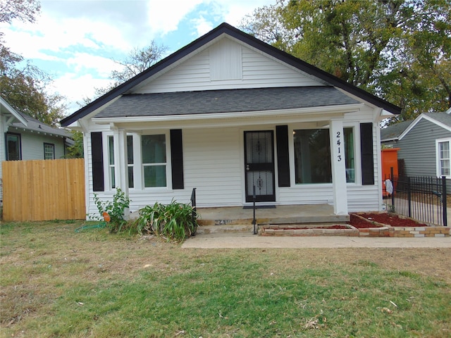 bungalow-style home featuring a porch and a front lawn