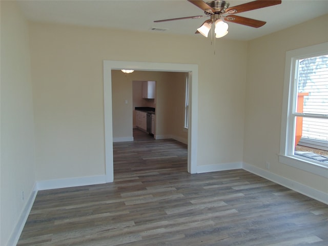 unfurnished room with ceiling fan and wood-type flooring