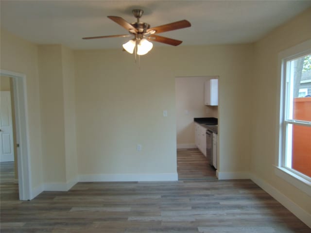 interior space with light hardwood / wood-style floors and ceiling fan