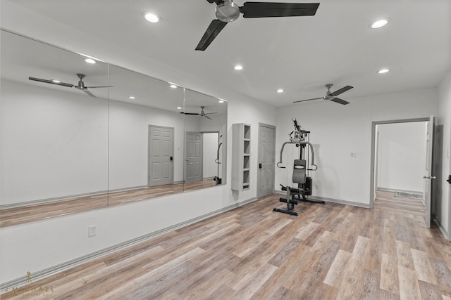 workout room featuring light wood-type flooring