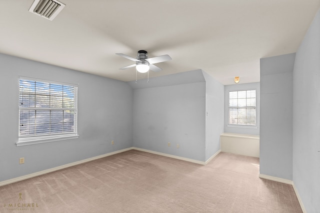 carpeted empty room with ceiling fan