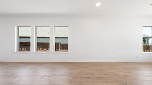 spare room featuring light hardwood / wood-style floors