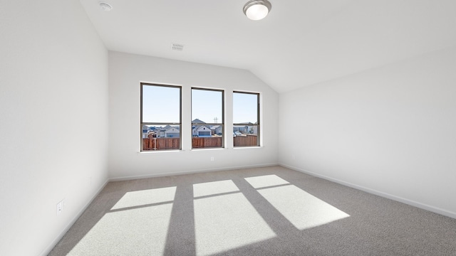 additional living space with light carpet and lofted ceiling