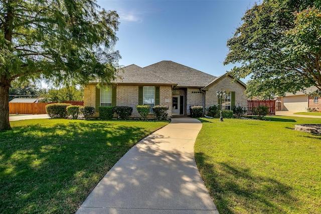 view of front of property featuring a garage and a front lawn