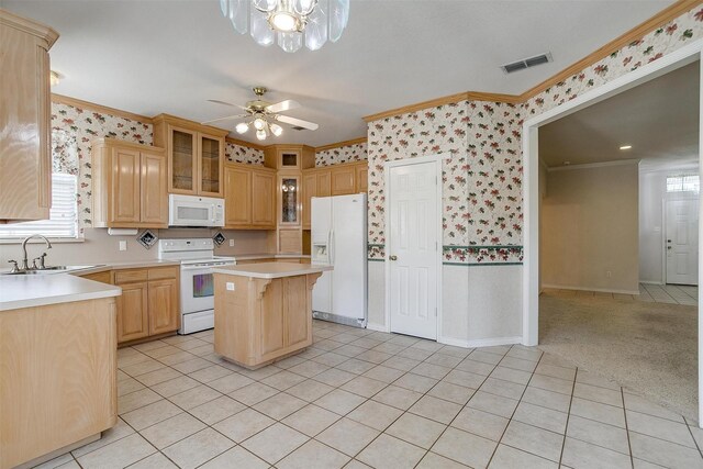 interior space with crown molding, light colored carpet, and ceiling fan