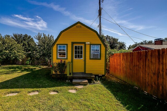 view of side of home featuring a lawn