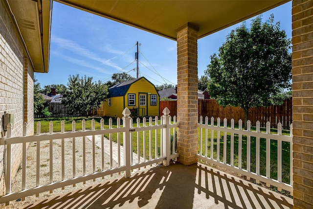 view of patio with a storage shed