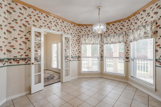 unfurnished dining area with crown molding, a chandelier, and light tile patterned floors