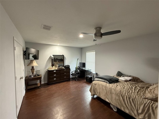 bedroom featuring ceiling fan and dark hardwood / wood-style flooring