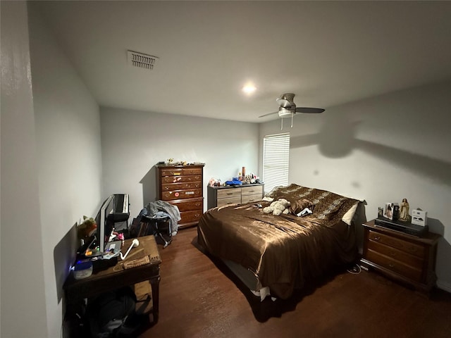 bedroom featuring ceiling fan and dark wood-type flooring