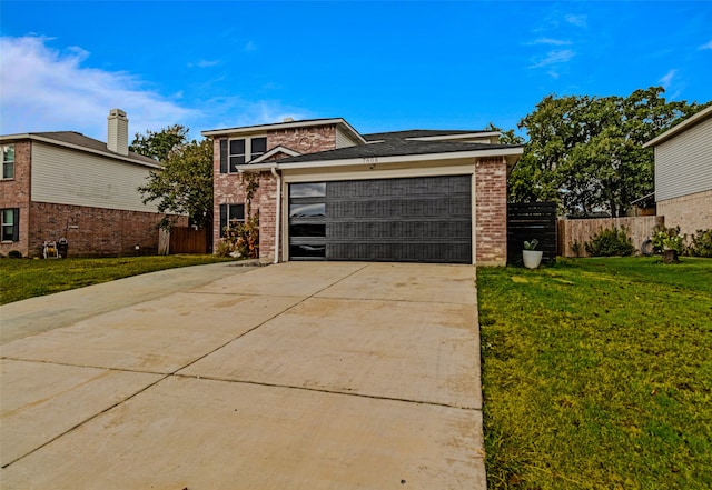 view of front facade with a garage and a front yard