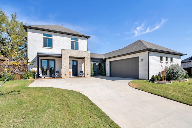 view of front facade with a front yard and a garage