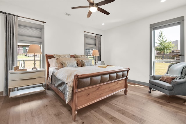 bedroom featuring wood-type flooring and ceiling fan