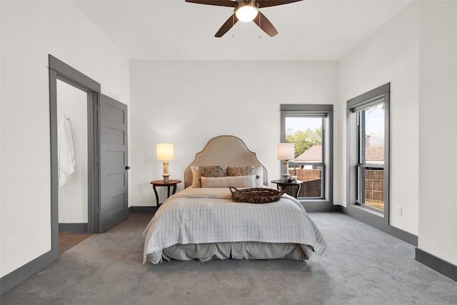 bedroom with ceiling fan and carpet floors