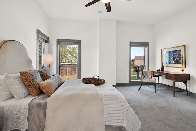 bedroom featuring carpet flooring, multiple windows, and ceiling fan