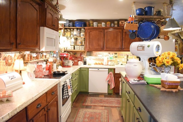 kitchen featuring white appliances, backsplash, and dark wood-type flooring