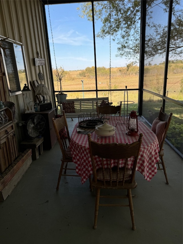 sunroom / solarium with a rural view