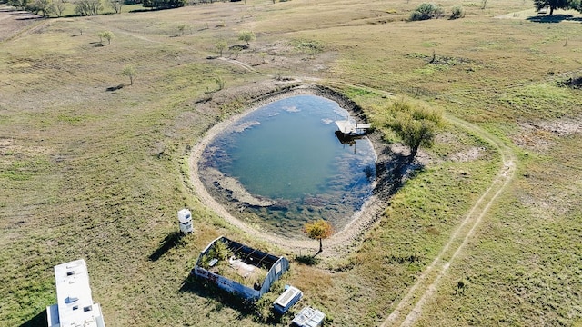 birds eye view of property with a water view and a rural view